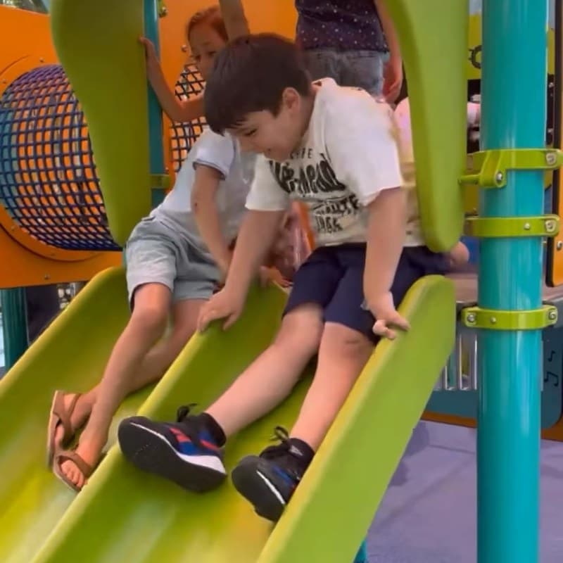 Children playing on the playground slide